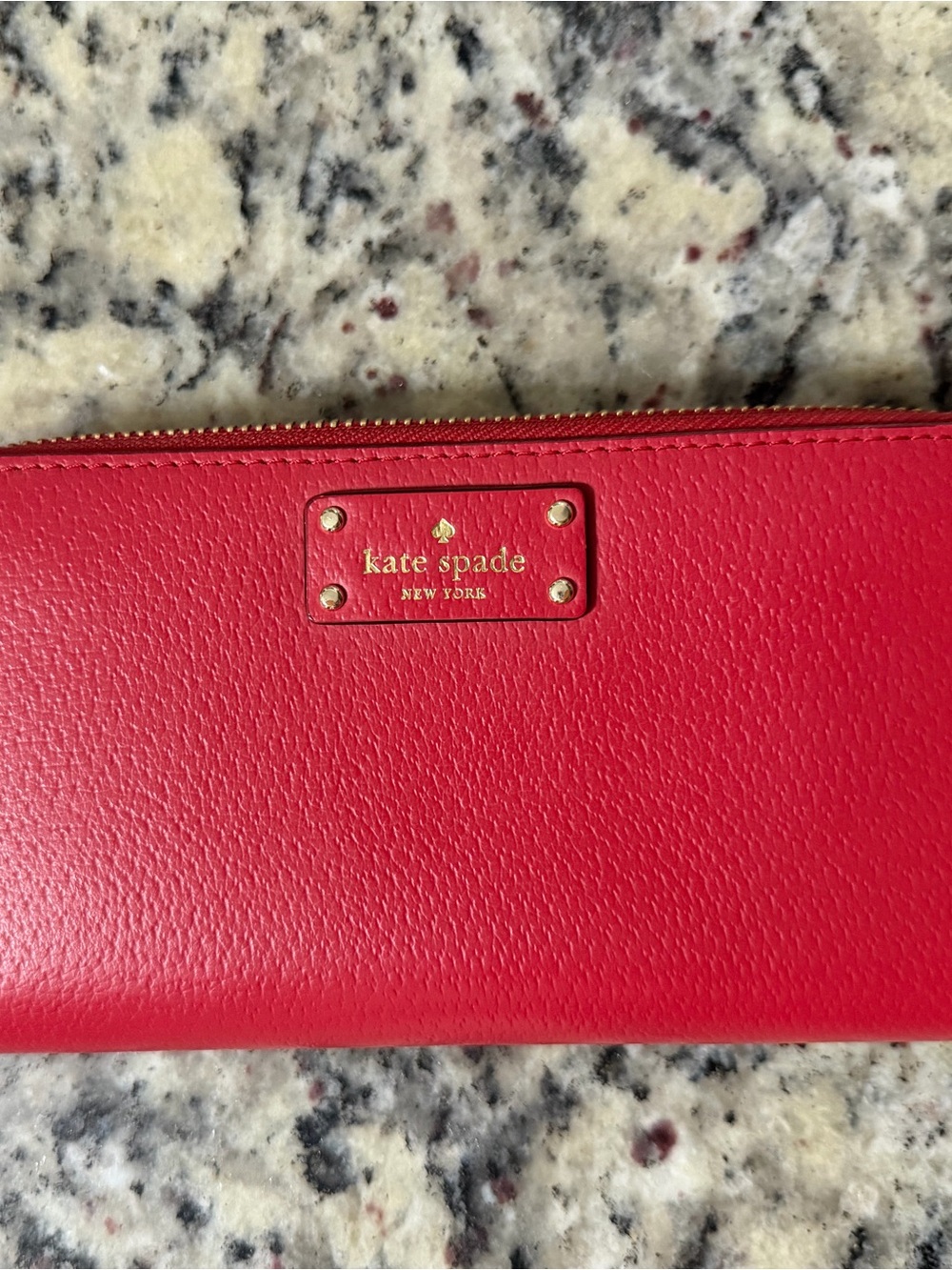 kate spade red pebbled leather zip-around wallet with gold logo